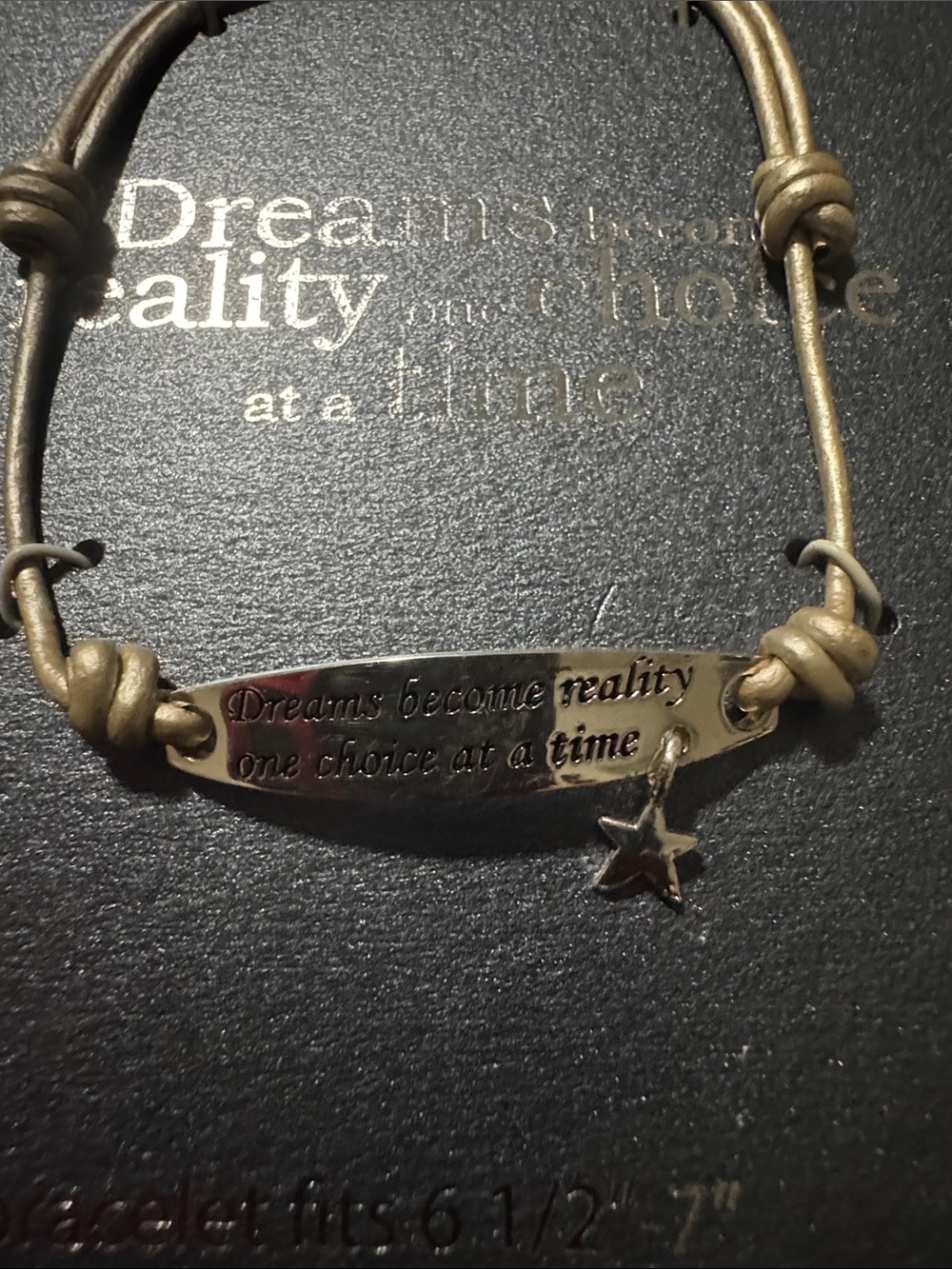 Leather bracelet fits 6 1/2”-7” with silver plated charm